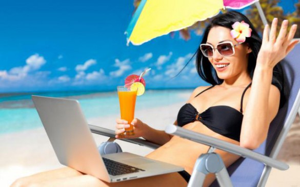 girl with laptop beach