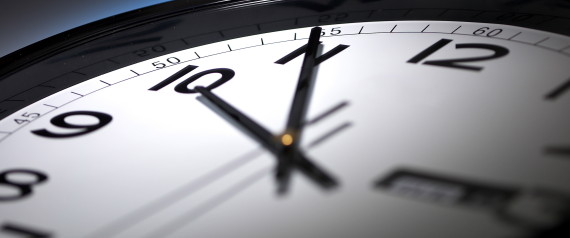 minute hour second hand timeclock late hour black and white clock on a dark blue background